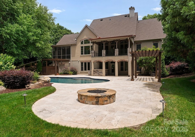 1108 Shinnecock Ln, Waxhaw, NC 28173 - swimming pool featuring a sunroom, a fire pit, a patio, a pergola, and a lawn