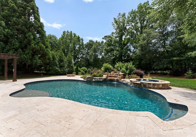 1108 Shinnecock Ln, Waxhaw, NC 28173 - view of pool featuring a pool with connected hot tub, a patio, and view of scattered trees