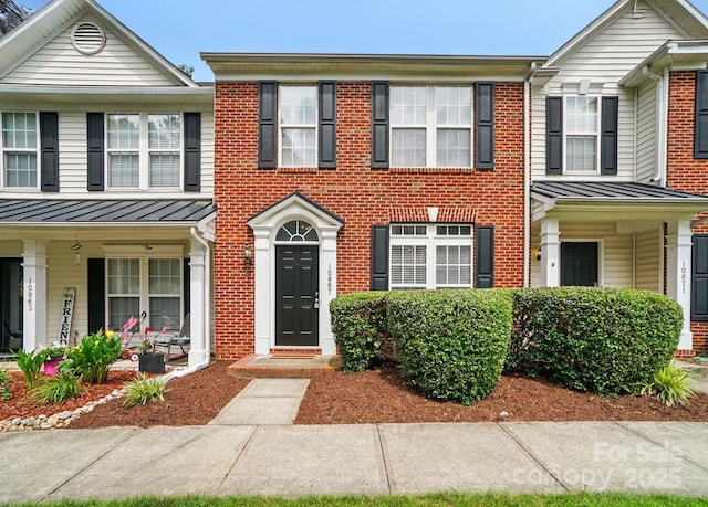 10867 Garden Oaks Ln, Charlotte, NC 28273 - multi unit property featuring a standing seam roof, brick siding, metal roof, and a porch