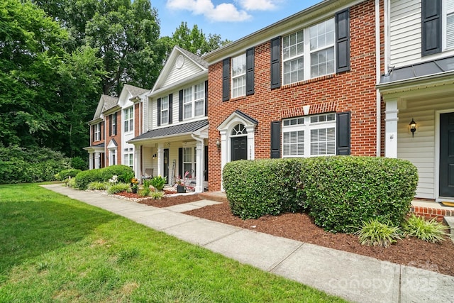10867 Garden Oaks Ln, Charlotte, NC 28273 - view of property featuring a front yard and brick siding