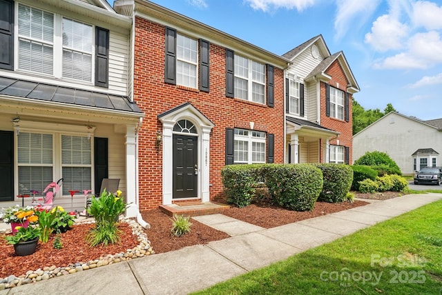 10867 Garden Oaks Ln, Charlotte, NC 28273 - townhome / multi-family property featuring brick siding and a standing seam roof