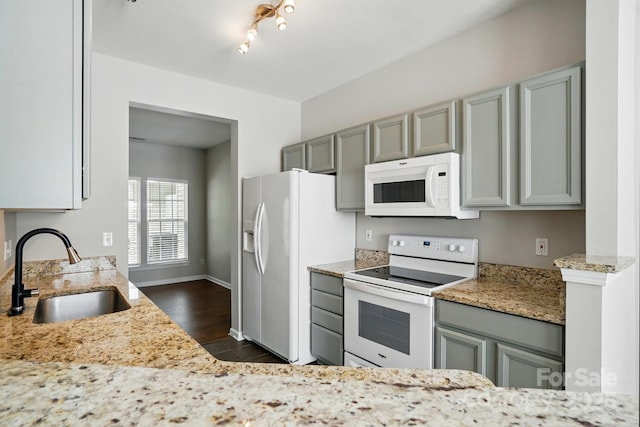 10867 Garden Oaks Ln, Charlotte, NC 28273 - kitchen featuring white appliances, a sink, gray cabinets, light stone counters, and dark tile patterned floors