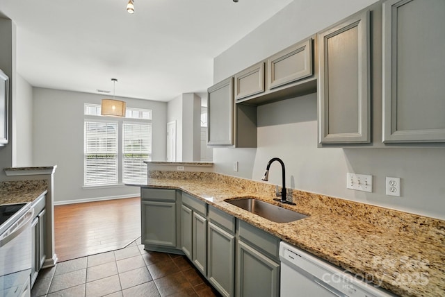 10867 Garden Oaks Ln, Charlotte, NC 28273 - kitchen with a sink, gray cabinets, range, and dark tile patterned floors