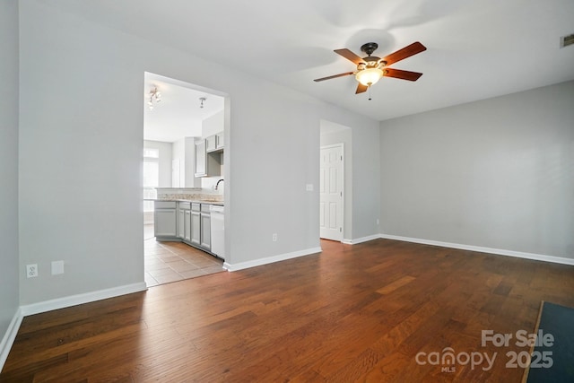 10867 Garden Oaks Ln, Charlotte, NC 28273 - unfurnished living room with ceiling fan, wood finished floors, and baseboards