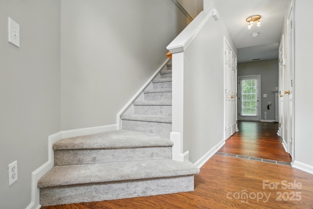 10867 Garden Oaks Ln, Charlotte, NC 28273 - staircase featuring wood finished floors and baseboards