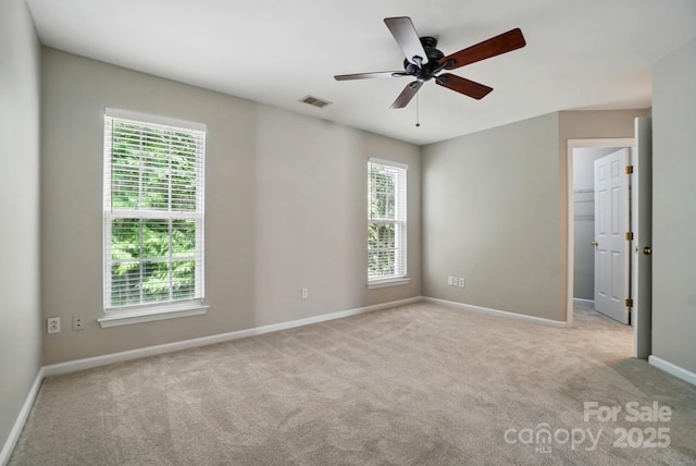 10867 Garden Oaks Ln, Charlotte, NC 28273 - carpeted spare room with healthy amount of natural light, baseboards, and a ceiling fan