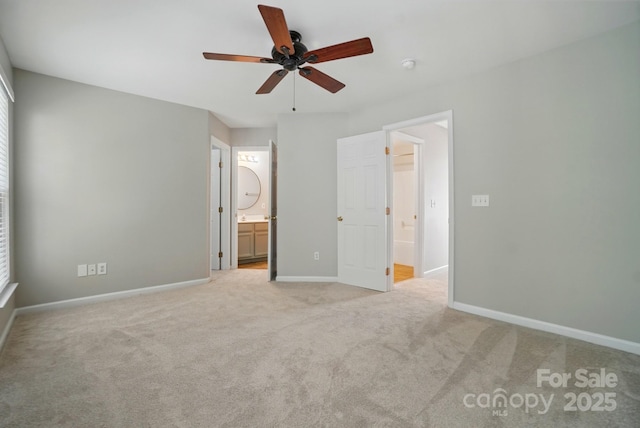 10867 Garden Oaks Ln, Charlotte, NC 28273 - unfurnished bedroom featuring light colored carpet, connected bathroom, baseboards, and multiple windows