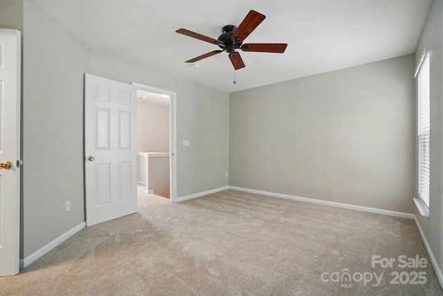 10867 Garden Oaks Ln, Charlotte, NC 28273 - unfurnished bedroom with multiple windows, carpet flooring, and baseboards