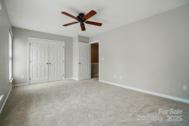 10867 Garden Oaks Ln, Charlotte, NC 28273 - unfurnished bedroom with baseboards, a closet, carpet flooring, and a ceiling fan