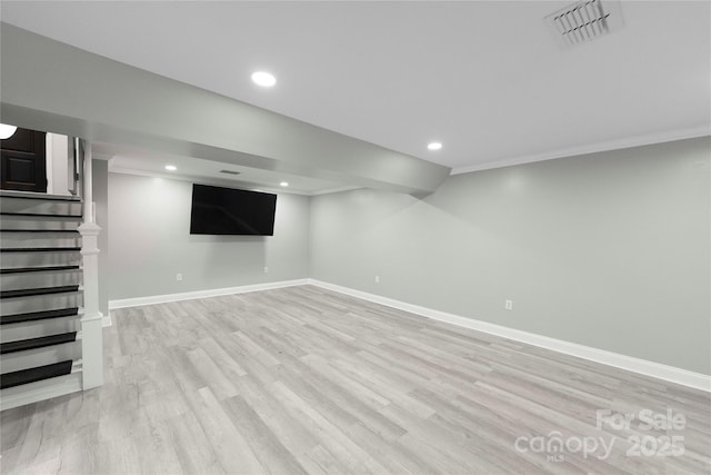 2011 Hampton Heights St, Lenoir, NC 28645 - finished below grade area with light wood-type flooring, baseboards, recessed lighting, stairway, and crown molding