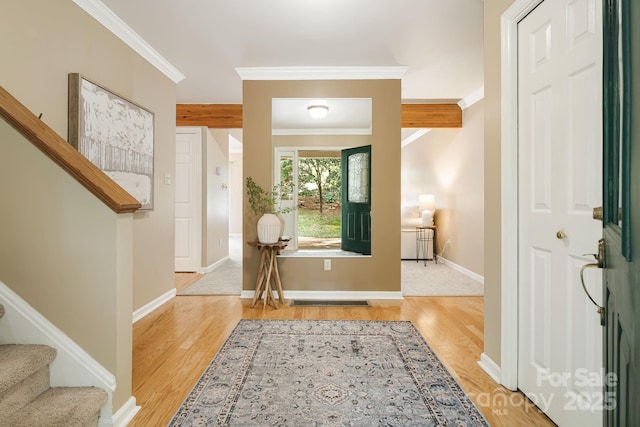 212 Riva Ridge Dr, Fairview, NC 28730 - foyer entrance with crown molding, wood finished floors, stairway, and baseboards