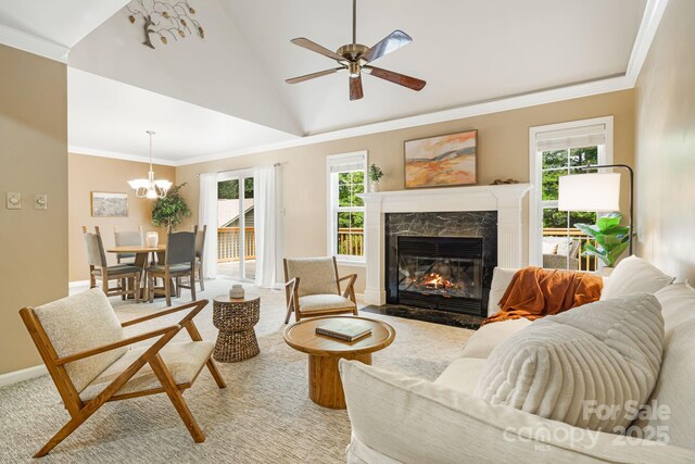 212 Riva Ridge Dr, Fairview, NC 28730 - living area with a fireplace, ceiling fan, healthy amount of natural light, ornamental molding, and vaulted ceiling