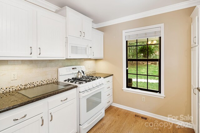 212 Riva Ridge Dr, Fairview, NC 28730 - kitchen with white appliances, plenty of natural light, backsplash, baseboards, and ornamental molding