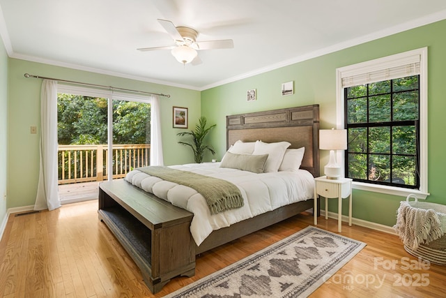 212 Riva Ridge Dr, Fairview, NC 28730 - bedroom featuring access to exterior, baseboards, multiple windows, crown molding, and wood finished floors