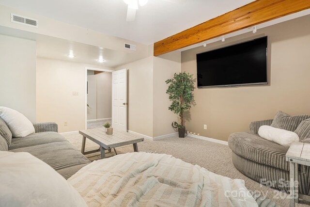 212 Riva Ridge Dr, Fairview, NC 28730 - living area with carpet flooring, baseboards, a ceiling fan, and beam ceiling