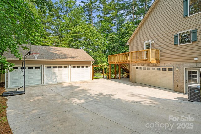 212 Riva Ridge Dr, Fairview, NC 28730 - garage with central AC unit and concrete driveway