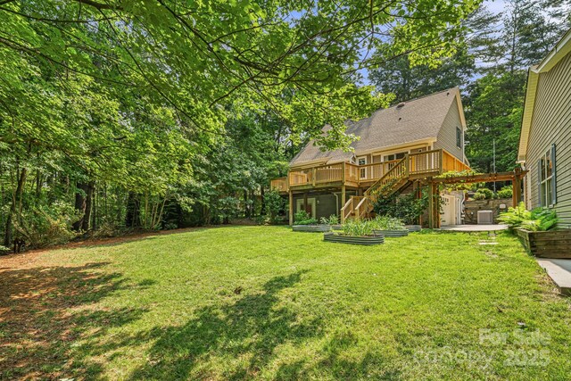212 Riva Ridge Dr, Fairview, NC 28730 - view of grassy yard with stairway, a wooden deck, central AC, and a patio