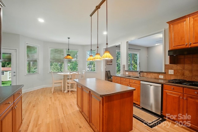 129 N Audubon Ave, Mooresville, NC 28117 - kitchen featuring stainless steel dishwasher, light wood-type flooring, under cabinet range hood, plenty of natural light, and recessed lighting