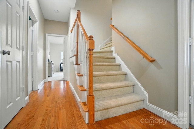 129 N Audubon Ave, Mooresville, NC 28117 - stairway featuring wood finished floors and baseboards
