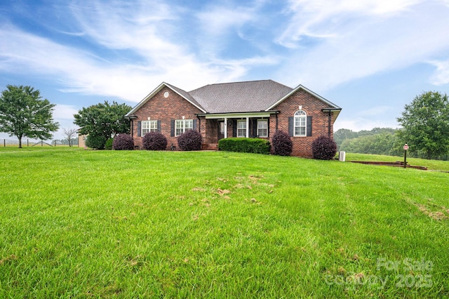 2817 Long Cir Unit 1, Iron Station, NC 28080 - view of front of property featuring brick siding, a front yard, and a shingled roof