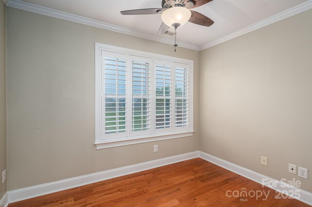 2817 Long Cir Unit 1, Iron Station, NC 28080 - unfurnished room with baseboards, a ceiling fan, wood finished floors, and ornamental molding