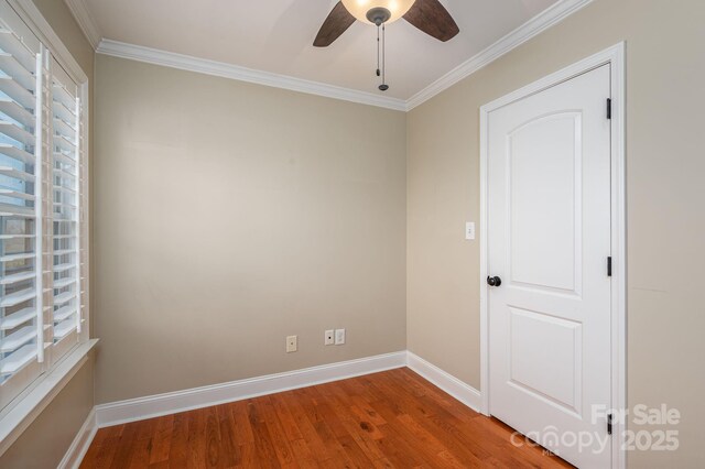 2817 Long Cir Unit 1, Iron Station, NC 28080 - spare room featuring a ceiling fan, plenty of natural light, wood finished floors, baseboards, and ornamental molding