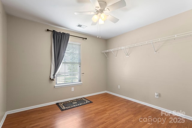 4764 Brockton Ct NW, Concord, NC 28027 - spare room with wood finished floors, baseboards, and ceiling fan