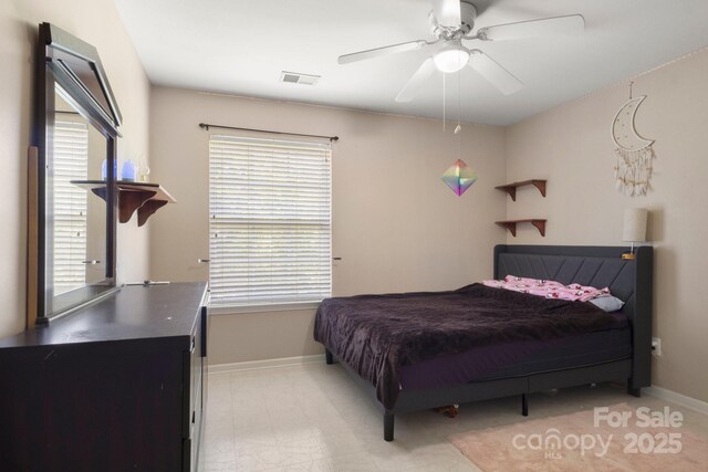 4764 Brockton Ct NW, Concord, NC 28027 - bedroom featuring multiple windows, baseboards, and a ceiling fan