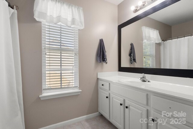 4764 Brockton Ct NW, Concord, NC 28027 - full bathroom with vanity, tile patterned floors, baseboards, and a shower with shower curtain