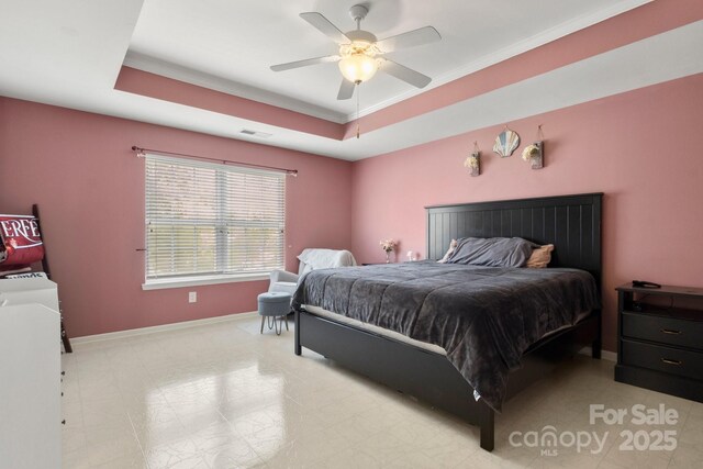 4764 Brockton Ct NW, Concord, NC 28027 - bedroom featuring baseboards, ornamental molding, a ceiling fan, a raised ceiling, and light flooring
