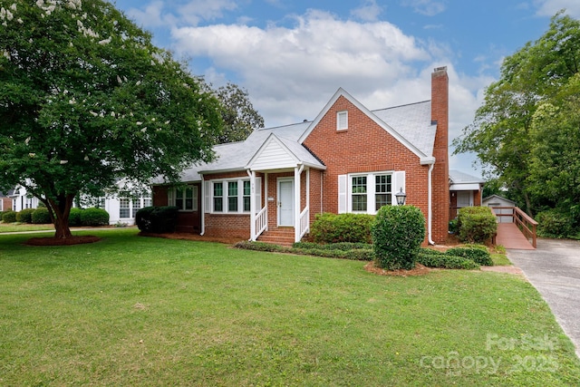 761 Milton Ave, Rock Hill, SC 29730 - view of front of home with brick siding, a chimney, a front lawn, and an outdoor structure