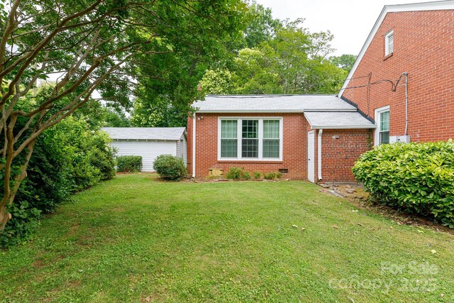761 Milton Ave, Rock Hill, SC 29730 - view of front of home with brick siding, a front yard, crawl space, and roof with shingles