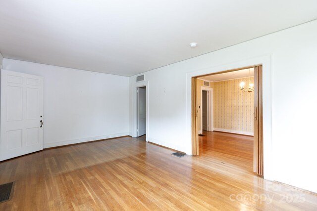 761 Milton Ave, Rock Hill, SC 29730 - unfurnished room with a chandelier, light wood finished floors, and baseboards