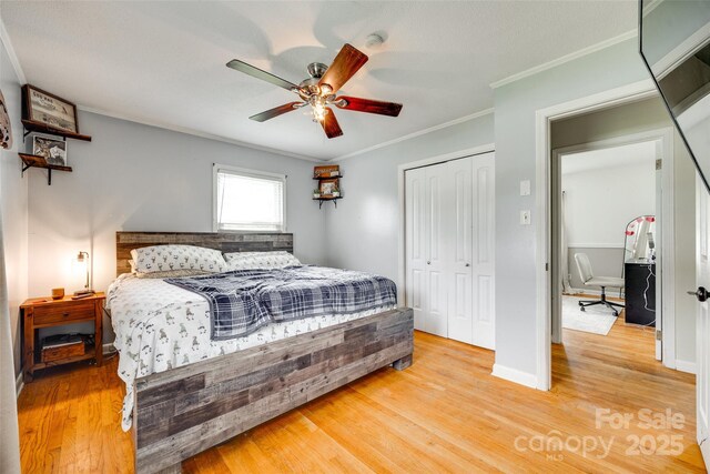 739 Springdale Rd, Rock Hill, SC 29730 - bedroom with light wood-style floors, a closet, crown molding, and a ceiling fan