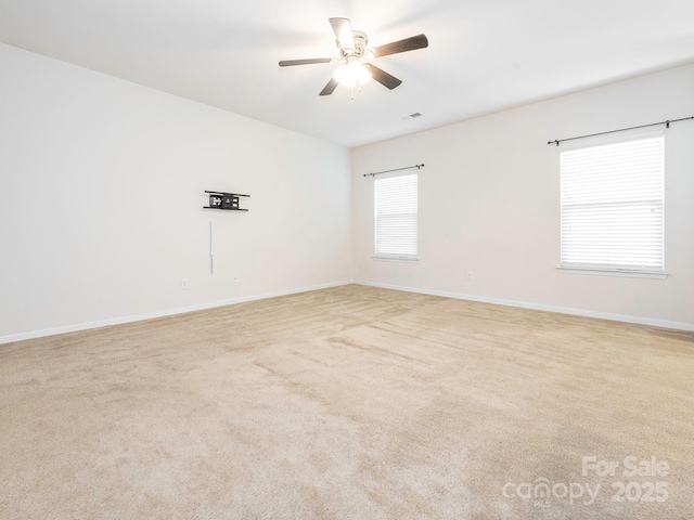 709 Volta Dr NW, Concord, NC 28027 - empty room with a ceiling fan, baseboards, and light carpet