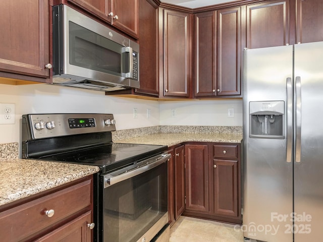 709 Volta Dr NW, Concord, NC 28027 - kitchen featuring appliances with stainless steel finishes and light stone countertops