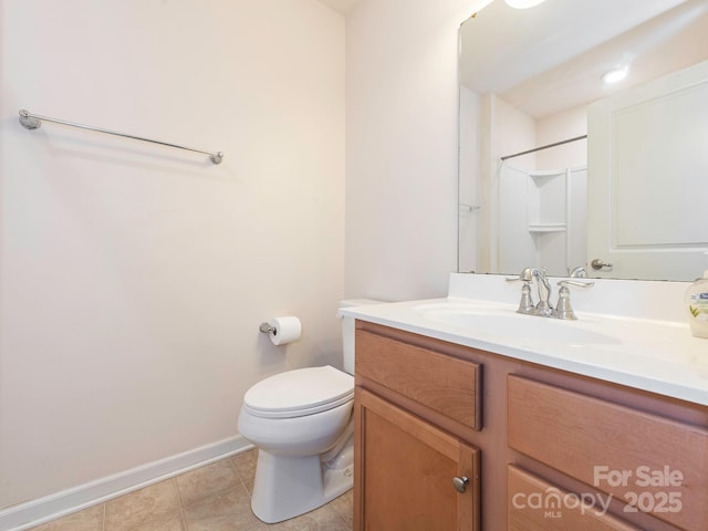 709 Volta Dr NW, Concord, NC 28027 - full bath with vanity, baseboards, toilet, and tile patterned floors