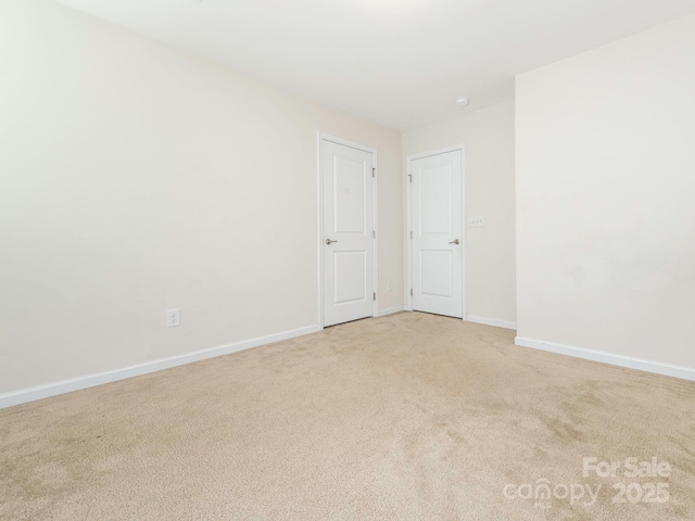 709 Volta Dr NW, Concord, NC 28027 - empty room featuring light colored carpet and baseboards