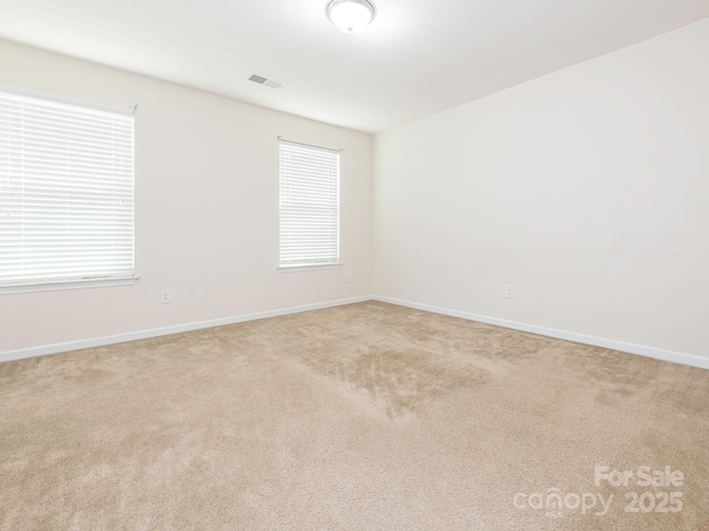 709 Volta Dr NW, Concord, NC 28027 - carpeted spare room featuring baseboards