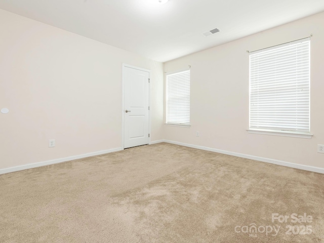 709 Volta Dr NW, Concord, NC 28027 - spare room featuring carpet floors and baseboards