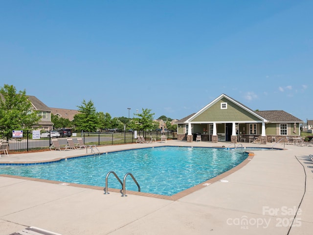 709 Volta Dr NW, Concord, NC 28027 - community pool with a patio
