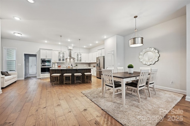10022 Wayfair Meadow Ct, Charlotte, NC 28277 - dining room with light wood-type flooring, baseboards, and recessed lighting