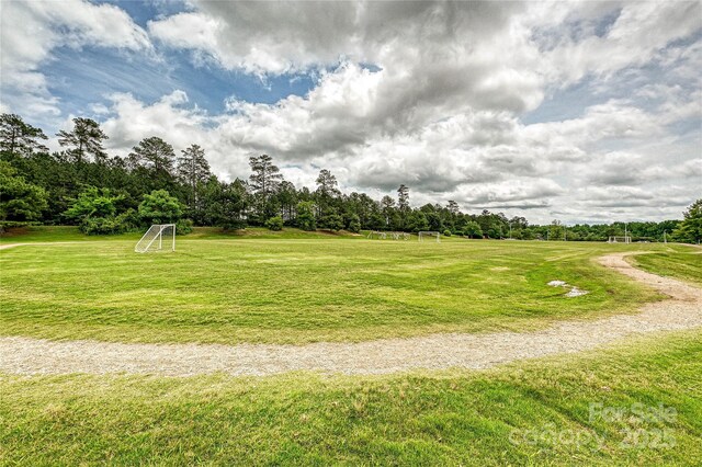10022 Wayfair Meadow Ct, Charlotte, NC 28277 - view of yard with a sport area and view of wooded area