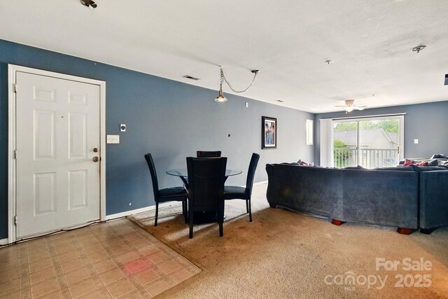 1134 Plaza Walk Dr, Charlotte, NC 28215 - dining room featuring ceiling fan, baseboards, and light carpet