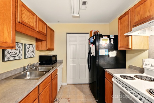 1134 Plaza Walk Dr, Charlotte, NC 28215 - kitchen featuring white appliances, a sink, brown cabinetry, and light countertops