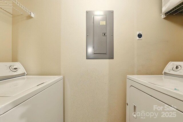 1134 Plaza Walk Dr, Charlotte, NC 28215 - laundry area with electric panel and washing machine and clothes dryer