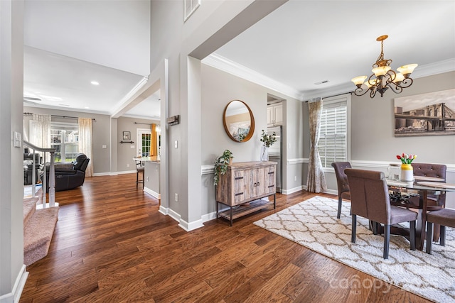 12312 Mcallister Park Dr, Charlotte, NC 28277 - dining area with a chandelier, crown molding, wood finished floors, baseboards, and recessed lighting