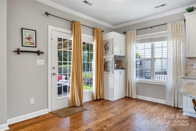 12312 Mcallister Park Dr, Charlotte, NC 28277 - doorway with wood finished floors, crown molding, baseboards, and healthy amount of natural light
