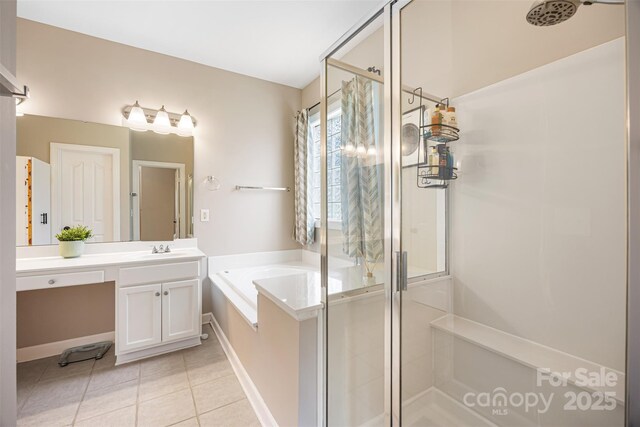 12312 Mcallister Park Dr, Charlotte, NC 28277 - full bathroom featuring a stall shower, tile patterned floors, a garden tub, vanity, and baseboards