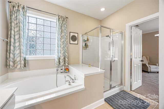 12312 Mcallister Park Dr, Charlotte, NC 28277 - bathroom featuring a shower stall, a garden tub, tile patterned flooring, and recessed lighting